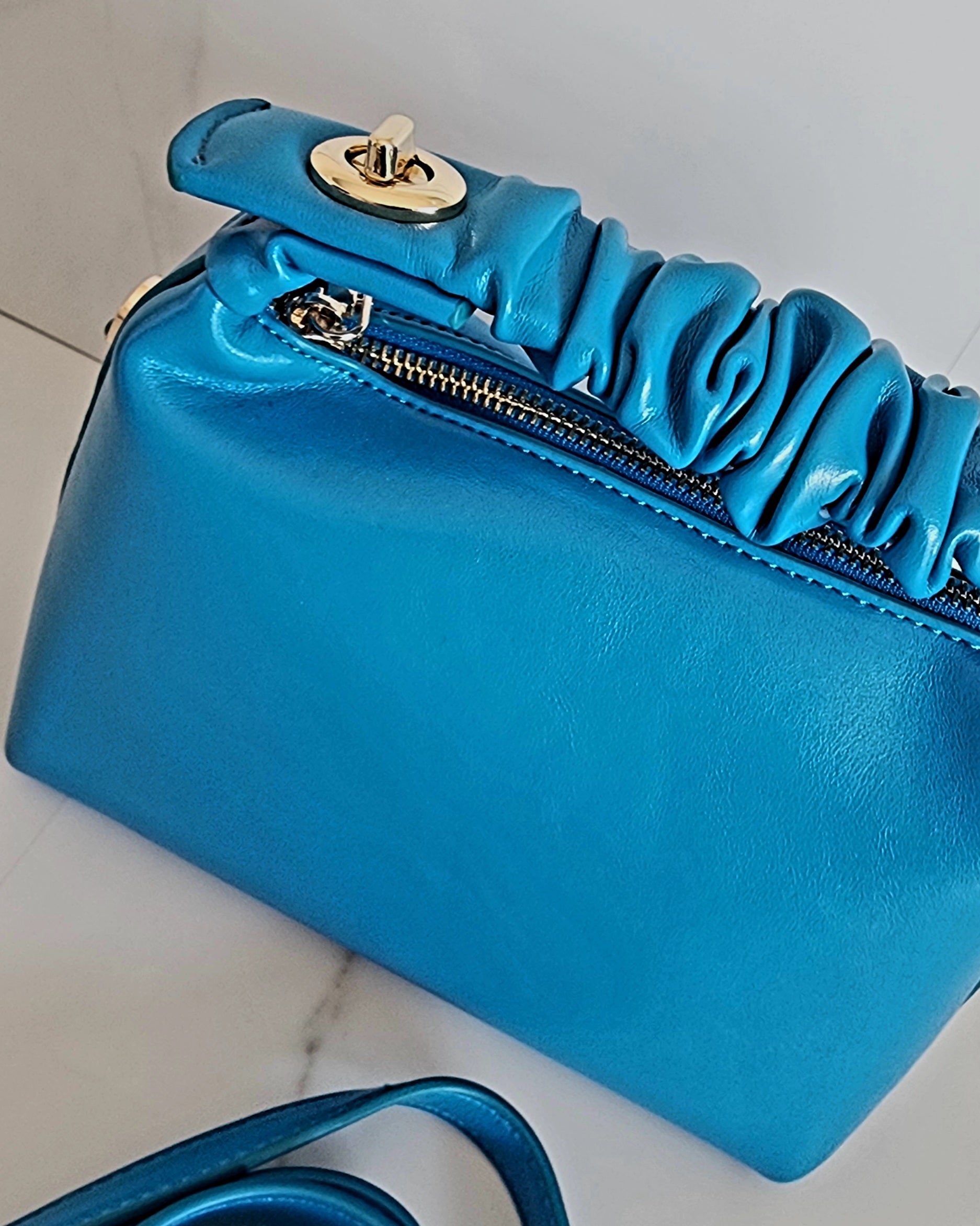 Rectangular handbag with soft curled handle and removable shoulder strap